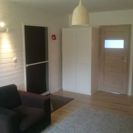 Holiday home Dom Drewniany *